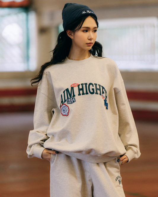 Aim Higher Club Unisex College Badge Crewneck sweatshirt/ Oat