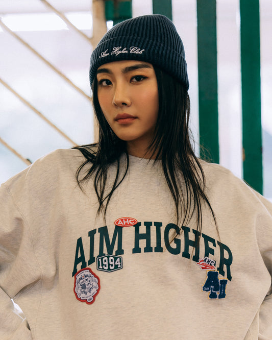 Aim Higher Club Unisex College Badge Crewneck sweatshirt/ Oat