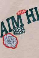 Aim Higher Club Unisex College Badge Crewneck sweatshirt/ Oat