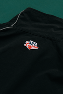 Aim Higher Club Unisex College Emblem Reflective Half Zip Windbreaker/ Black
