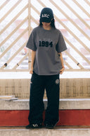 Aim Higher Club Unisex College Emblem Tee / Wash Light Charcoal