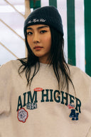 Aim Higher Club Unisex College Badge Crewneck sweatshirt/ Oat