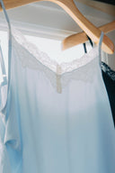 Aim Higher Club Core Asymmetric Lace Camisole Top/ Baby Blue